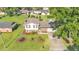 Charming two-story home featuring a well-manicured lawn and inviting landscaping, offering a warm curb appeal at 4908 Celia W Cir, Lakeland, FL 33813