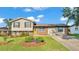 Charming two-story home with a well-manicured lawn and an inviting green front door at 4908 Celia W Cir, Lakeland, FL 33813