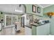 Charming kitchen featuring stainless steel appliances, tile flooring, and a doorway that leads to the backyard at 4908 Celia W Cir, Lakeland, FL 33813