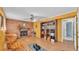 Cozy living room with a brick fireplace, rocking chair, home exercise equipment and large built-in shelving unit at 4908 Celia W Cir, Lakeland, FL 33813