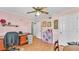Home office with natural lighting, wood floors, and pastel pink walls at 4908 Celia W Cir, Lakeland, FL 33813
