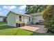 Exterior view of backyard shed with an adjacent patio, plus a grill at 4908 Celia W Cir, Lakeland, FL 33813