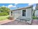 Exterior view of the shed in the backyard with a small patio at 4908 Celia W Cir, Lakeland, FL 33813