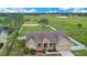Stunning aerial view of a charming single-Gathering home with a well-manicured front yard at 5370 Knights Station Rd, Lakeland, FL 33810