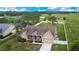 Beautiful aerial view of a single Gathering house showcasing landscaped yard and serene surroundings at 5370 Knights Station Rd, Lakeland, FL 33810