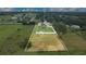 Large grassy home lot outlined in white with views of the surrounding area at 5370 Knights Station Rd, Lakeland, FL 33810