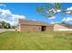 Spacious backyard with a large grassy area and a white fence at 5370 Knights Station Rd, Lakeland, FL 33810