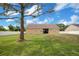 Spacious backyard with a large grassy area and a white fence at 5370 Knights Station Rd, Lakeland, FL 33810