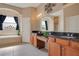 Bright bathroom featuring a soaking tub, dual sinks, and a private toilet area at 5370 Knights Station Rd, Lakeland, FL 33810