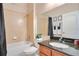 Bathroom featuring a shower-tub combo and a wood vanity with a granite countertop at 5370 Knights Station Rd, Lakeland, FL 33810