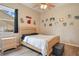 Neutral bedroom with a window, ceiling fan and hardwood floors at 5370 Knights Station Rd, Lakeland, FL 33810