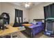 Bedroom with a desk, bed, and treadmill at 5370 Knights Station Rd, Lakeland, FL 33810