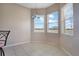 Bright dining area featuring tile flooring and sun-filled windows overlooking outdoor views at 5370 Knights Station Rd, Lakeland, FL 33810