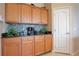 Cozy kitchen nook area featuring lovely wood cabinets, providing ample storage space at 5370 Knights Station Rd, Lakeland, FL 33810