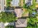 An aerial shot of the property location in a residential area with fire pit and fenced backyard at 544 Avenue G Se, Winter Haven, FL 33880