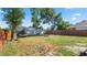 Large fenced backyard with a fire pit, shed, and hammock offering a peaceful retreat at 544 Avenue G Se, Winter Haven, FL 33880