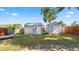 Well-maintained backyard with storage sheds, a hammock and fenced in yard at 544 Avenue G Se, Winter Haven, FL 33880