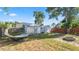 Spacious backyard featuring two storage sheds, a fire pit, and a relaxing hammock at 544 Avenue G Se, Winter Haven, FL 33880