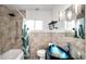 Updated bathroom with modern fixtures, vessel sink, and decorative tile at 544 Avenue G Se, Winter Haven, FL 33880