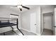 Neutral bedroom with bunk beds, ceiling fan, and wood-look flooring at 544 Avenue G Se, Winter Haven, FL 33880