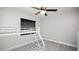 Bedroom featuring white bunk beds, ceiling fan, wood-look flooring, and a large window at 544 Avenue G Se, Winter Haven, FL 33880