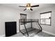 Bedroom featuring a bunk bed, ceiling fan, wood-look flooring, and lots of light from two windows at 544 Avenue G Se, Winter Haven, FL 33880