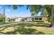 Charming single-story home featuring a long driveway and a neatly landscaped front yard at 544 Avenue G Se, Winter Haven, FL 33880
