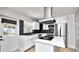 Modern kitchen with stainless steel appliances and white cabinets at 544 Avenue G Se, Winter Haven, FL 33880