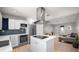 Open concept kitchen with modern stainless steel appliances and living room at 544 Avenue G Se, Winter Haven, FL 33880