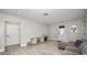 Bright and open living room with wood flooring, modern lighting, and ample space at 544 Avenue G Se, Winter Haven, FL 33880
