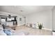 Spacious living room with wood floors and a view of the modern kitchen at 544 Avenue G Se, Winter Haven, FL 33880