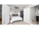 Bedroom with ceiling fan, tiled floors, neutral walls, and ensuite bathroom at 544 Avenue G Se, Winter Haven, FL 33880