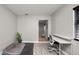 Bright office area with a modern desk, pet bed and view to the front door at 544 Avenue G Se, Winter Haven, FL 33880