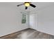 Bright bedroom with gray floors, white walls, and natural light at 5722 Antler Trl, Lakeland, FL 33811