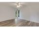 Bedroom with wood-look flooring and bright natural light from an exterior window at 5722 Antler Trl, Lakeland, FL 33811