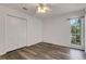 Bedroom featuring wood-look flooring and a large closet at 5722 Antler Trl, Lakeland, FL 33811