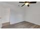 This bedroom features updated floors and a ceiling fan at 5722 Antler Trl, Lakeland, FL 33811