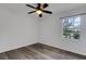 Bedroom featuring wood-look flooring and ceiling fan at 5722 Antler Trl, Lakeland, FL 33811