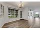 Dining room with chandelier and view into the living room at 5722 Antler Trl, Lakeland, FL 33811