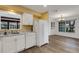 White kitchen featuring a refrigerator and view into the breakfast nook at 5722 Antler Trl, Lakeland, FL 33811