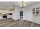 Bright kitchen featuring white cabinetry, stainless steel appliances and luxury vinyl plank flooring at 5722 Antler Trl, Lakeland, FL 33811