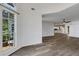 Open-concept living area featuring the kitchen, wood-look floors, and natural light at 5722 Antler Trl, Lakeland, FL 33811