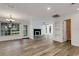 Large living room featuring updated flooring and views of the back and front yards at 5722 Antler Trl, Lakeland, FL 33811