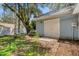 A backyard shed featuring a double door entrance and light blue siding at 5722 Antler Trl, Lakeland, FL 33811