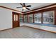 Sunroom with tiled floor and wood-trimmed windows providing an abundance of natural light at 5722 Antler Trl, Lakeland, FL 33811