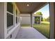 The back patio has a scenic view of the lawn and a screened-in porch at 6524 Great Bear Drive Blvd, Lakeland, FL 33805