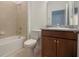 Charming bathroom featuring a granite vanity, tub, and tiled shower at 6524 Great Bear Drive Blvd, Lakeland, FL 33805