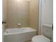 Cozy bathroom featuring a white bathtub and tiled walls at 6524 Great Bear Drive Blvd, Lakeland, FL 33805