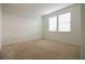 Bedroom with neutral carpet, light walls and a pair of windows allowing plenty of sunlight at 6524 Great Bear Drive Blvd, Lakeland, FL 33805