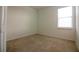 Bedroom features neutral carpet, light walls and window with blinds at 6524 Great Bear Drive Blvd, Lakeland, FL 33805